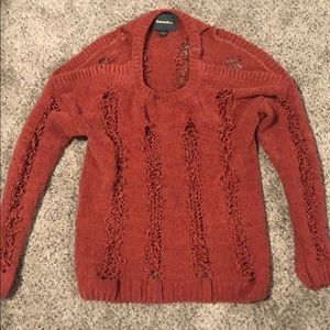 Knit sweater with open shoulders